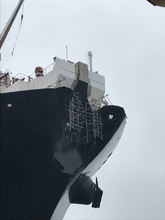 Suspended Scaffold on the bow of a massive oil tanker. 
